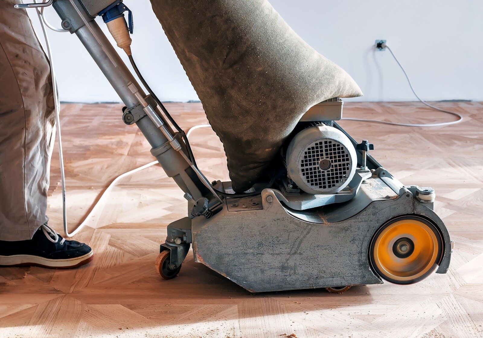 A sander on hardwood flooring | America's Flooring Store