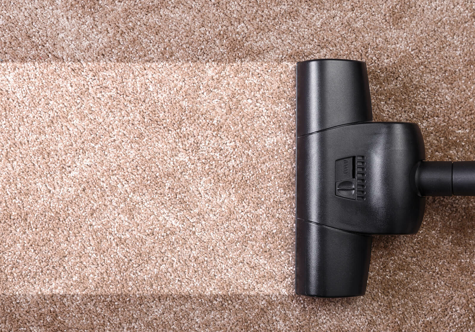 Vacuuming carpeting | America's Flooring Store