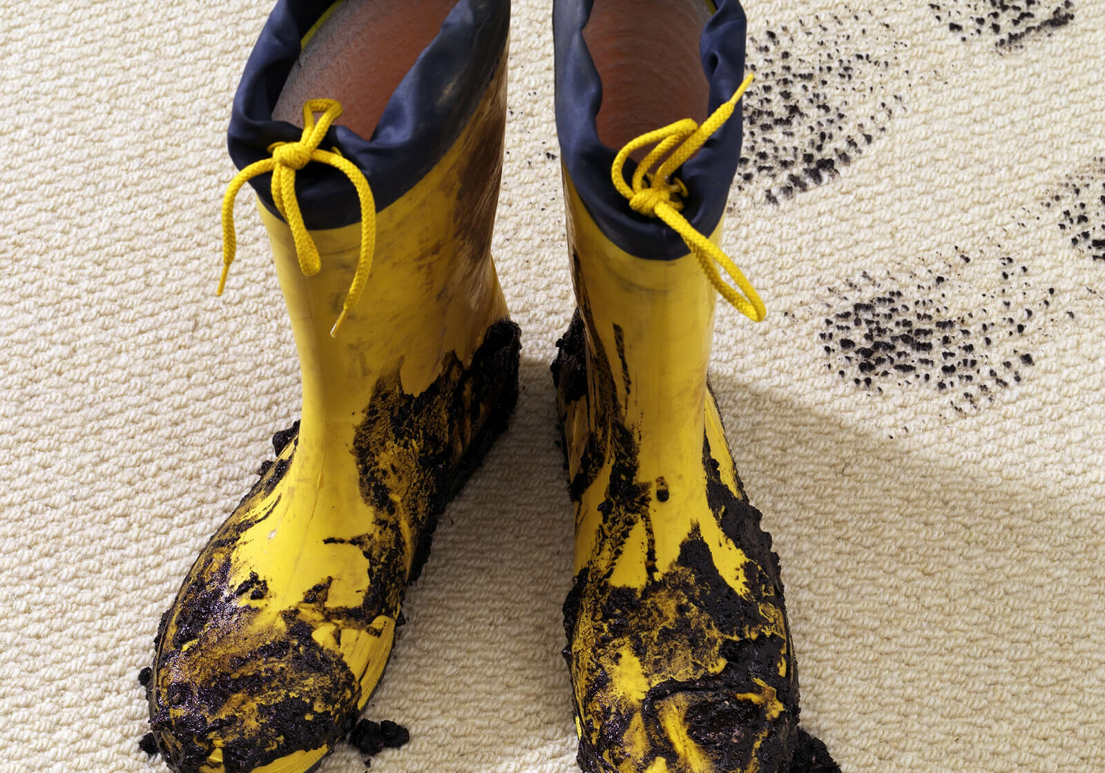 Muddy boots on carpeting | America's Flooring Store