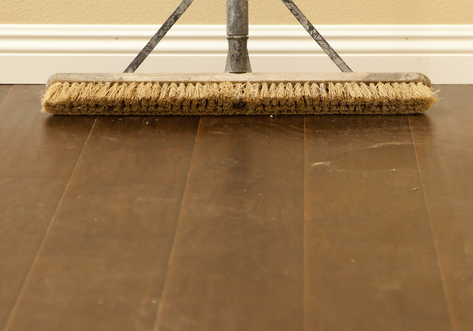 Broom on hardwood | America's Flooring Store